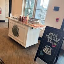 A mini pancake bar styled for brunches, showers, and event-day service